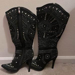 Size 7.5 Venus studded black heel boot. Never been worn.